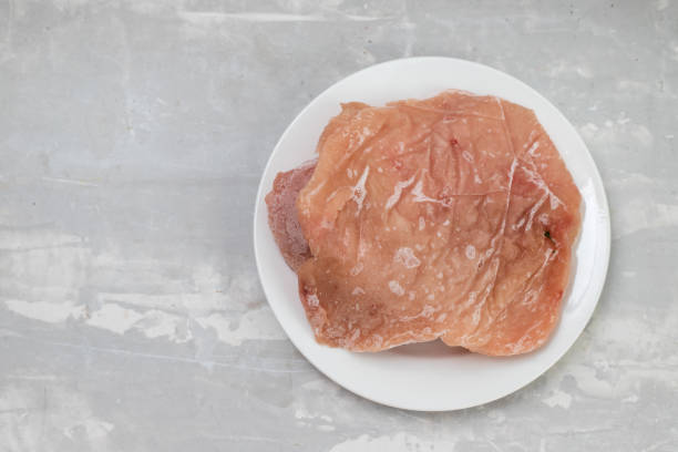 istock frozen meat turkey on white small plate 1356370405
