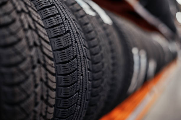istock car tires on a rack in a car store 1356370492