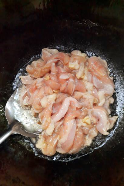 istock Raw Chicken meat in cooking pan - food preparation. 1356372461