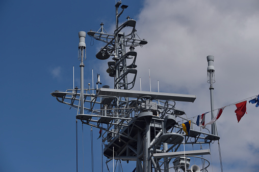 mast of a warship, full of antennas and other communications