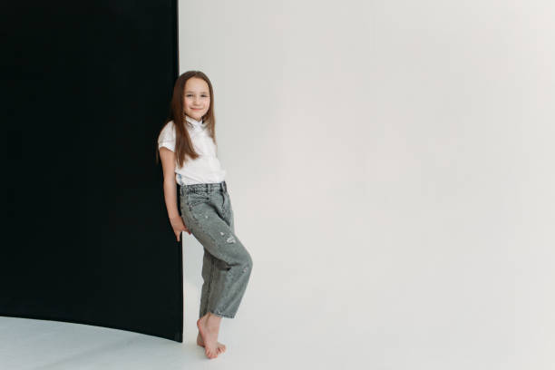 istock she looks out from behind a black wall 1356373086