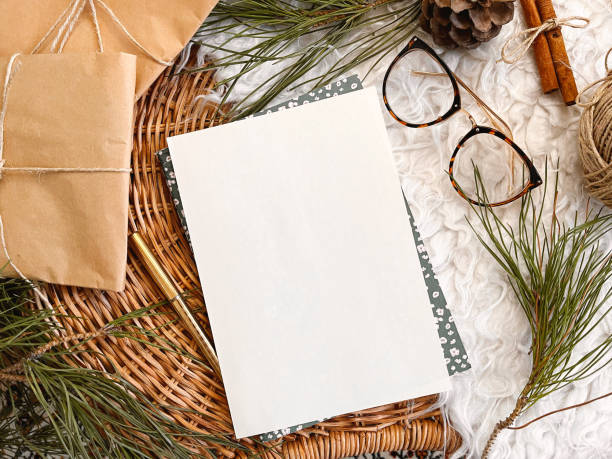 istock Christmas decorations and blank vintage paper on table, background, mockup 1356373788