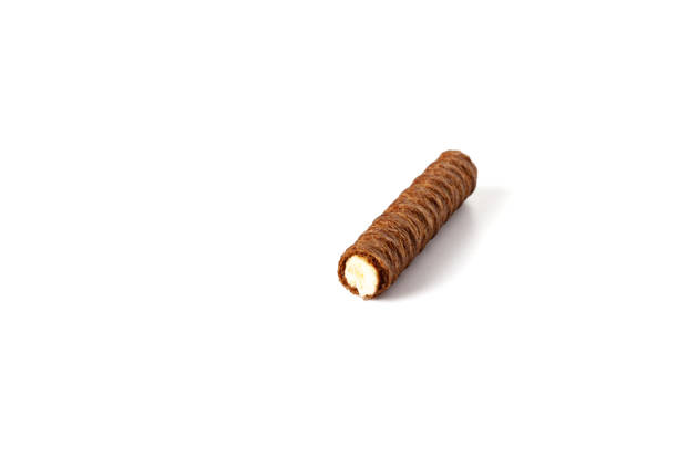 Brown wafer roll isolated on white background. Broken Chocolate wafer roll stick. Close up
