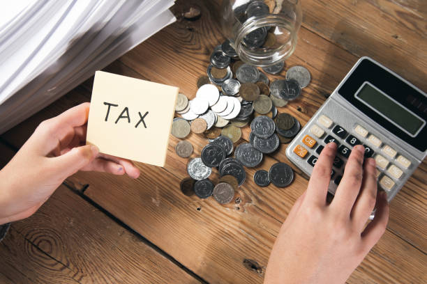 istock woman working in calculator with tax 1356377435