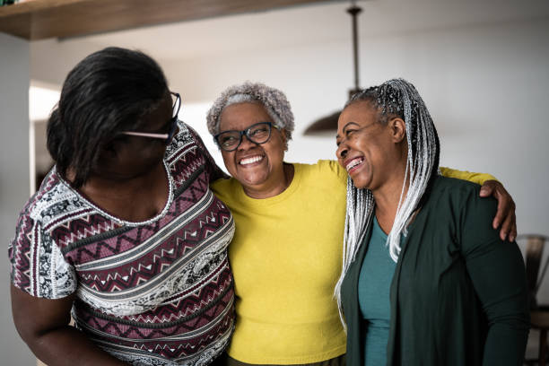 istock Senior women embracing each other at home 1356377459