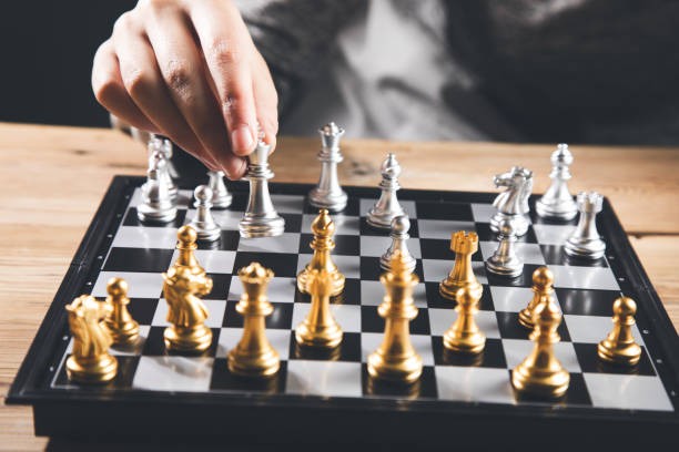 istock The woman is playing chess 1356377461