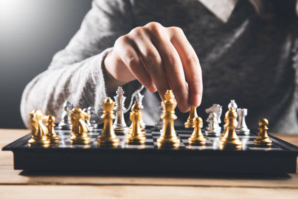 istock The woman is playing chess 1356377462