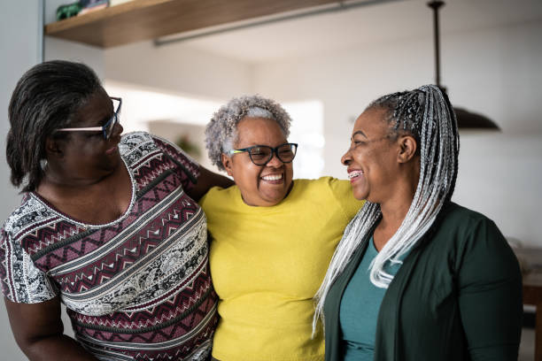 istock Senior women embracing each other at home 1356377465