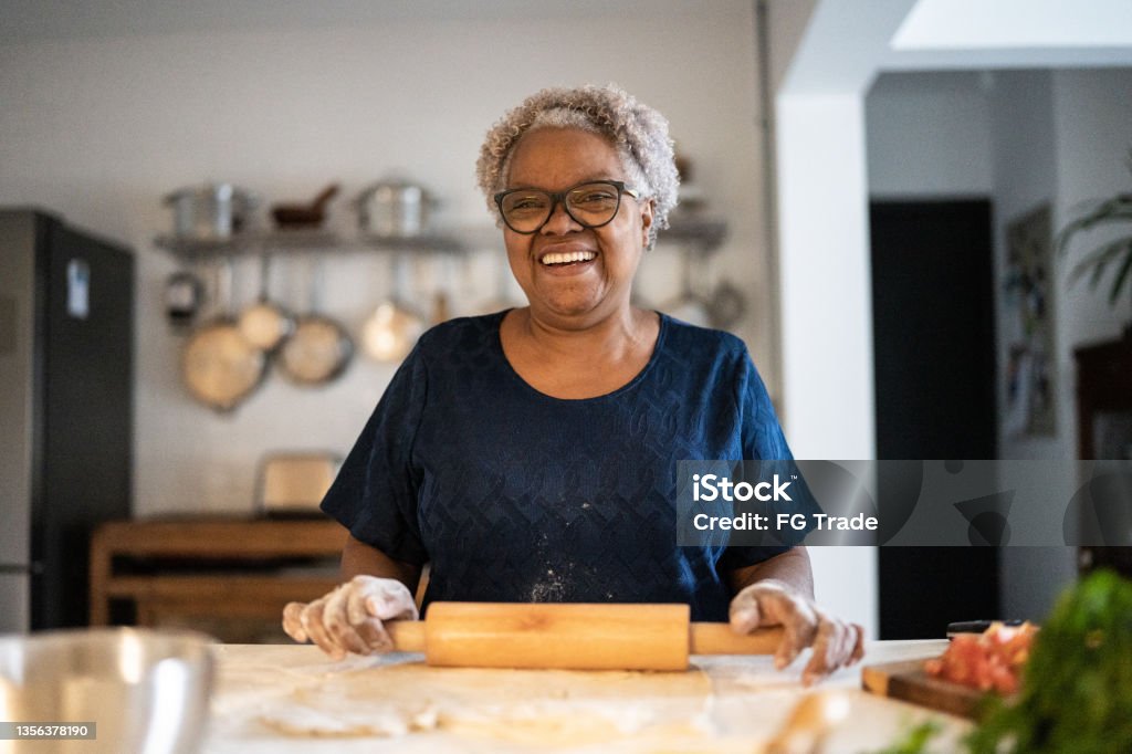 Portrait of a senior woman baking at home Senior Adult Stock Photo