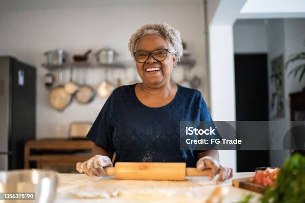 Portrait Of A Senior Woman Baking At Home Stock Photo - Download Image Now - Senior Adult, One Woman Only, Cooking