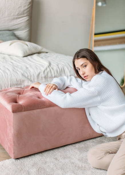 istock a girl in a bright room 1356378410