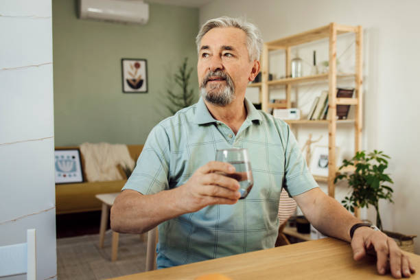 istock Portrait of a senior man drinking water 1356378978