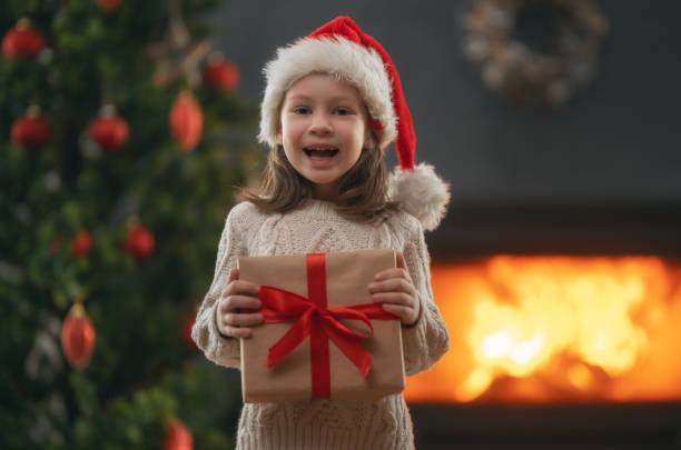 istock girl with Christmas gift 1356380248