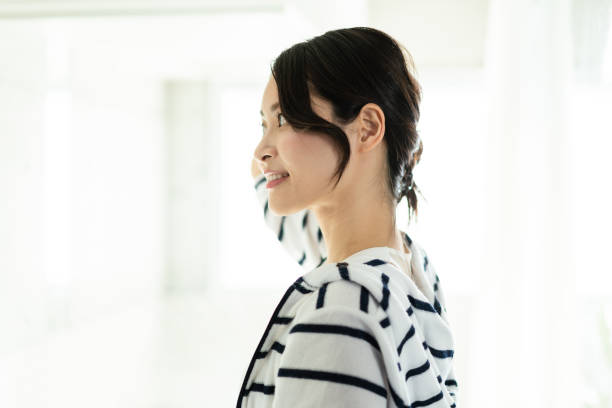 istock Young woman setting her hair 1356382756