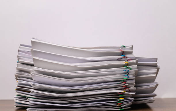 istock Stack of group report papers document clipped in color clips with copy space, business, and education concept. 1356384086