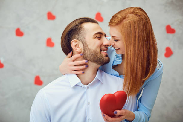 istock Happy couple with red heart. Valentine's day. 1356385430