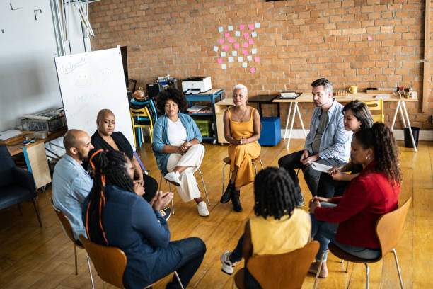 istock People in a meeting or group therapy 1356385563