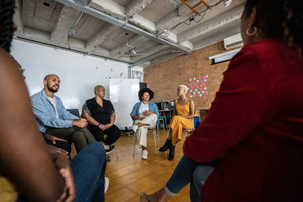 istock People in a meeting or group therapy 1356385588