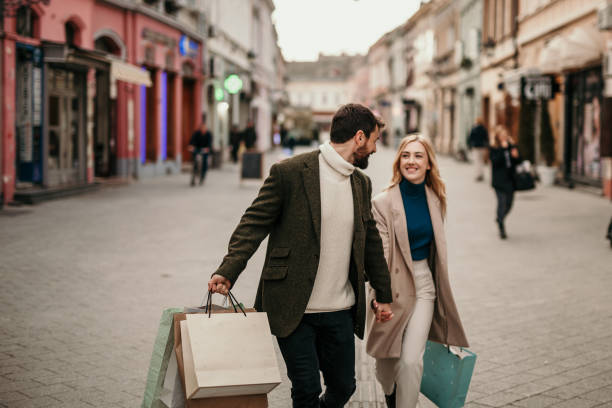 istock Couple walking in the street 1356385609
