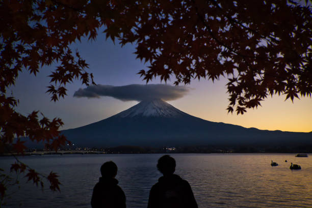 istock Sunset and Mt. Fuji surrounded by autumn leaves 1356386194