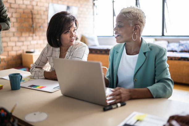 Business women doing a meeting using laptop in the office