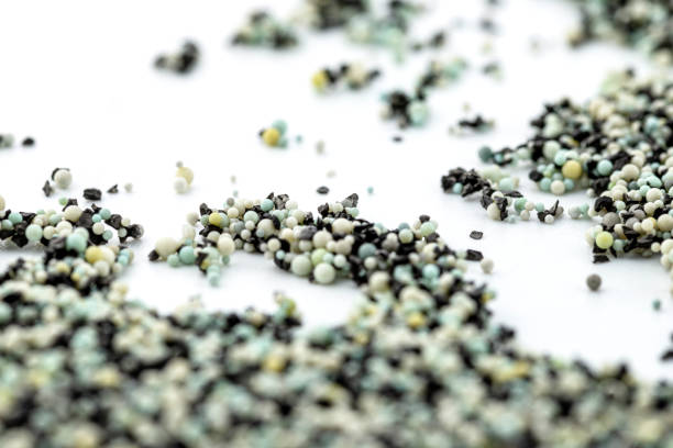 istock A background made out of strewn inside an activated carbon filter and water filter balls, isolated on a white background, selective focus in the center. 1356387942