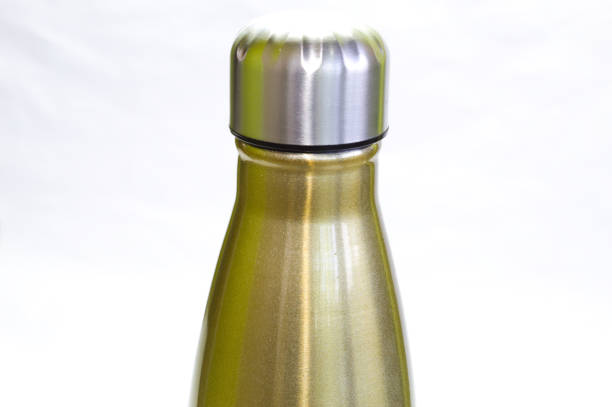 istock Golden metal bottle used for water 1356388916