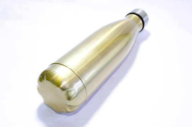 istock Golden metal bottle used for water 1356388920