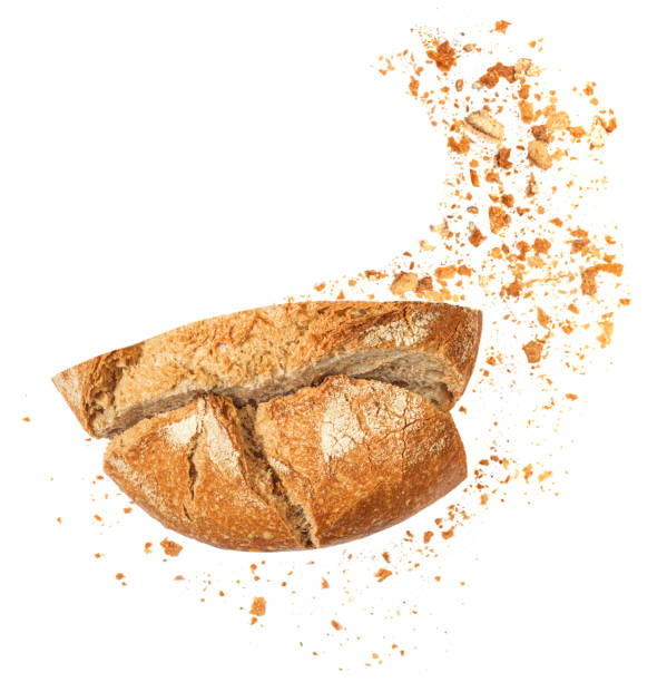istock Freshly baked Bread with crumbs  isolated on white background.  Sliced, cutted wheat bread. Bakery, rustic  traditional food concept. Top view