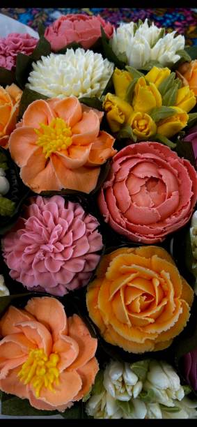 Frosting Flowers Cupcake Frosting Flowers wachs stock pictures, royalty-free photos & images