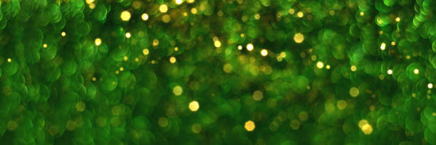 istock Green and golden glitter bokeh background banner 1356392947