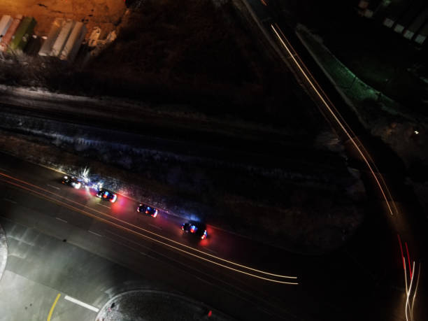 Uh oh even more Long exposure around traffic stop police car aerial view stock pictures, royalty-free photos & images