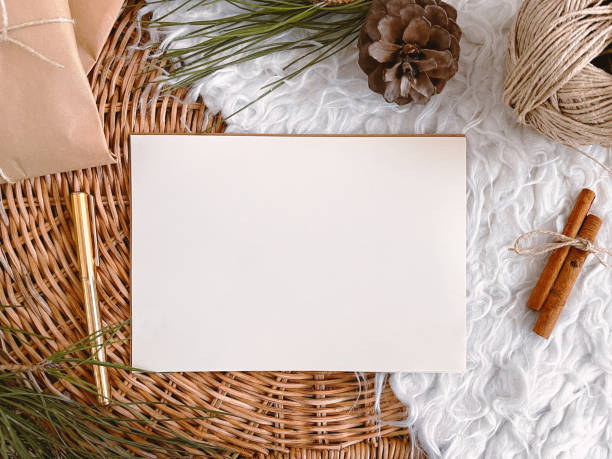 istock Christmas decorations and blank vintage paper on table, background, mockup 1356394960