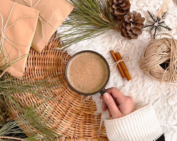 istock Christmas decorations, hand holding coffee, background, mockup 1356394963