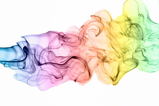 Flowing Rainbow Coloured Smoke Pattern On A White Background