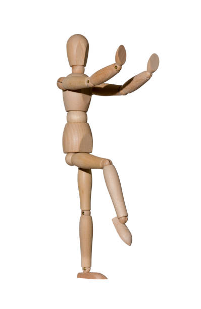 istock wooden mannequin shows dance movement, isolated on white background 1356397108
