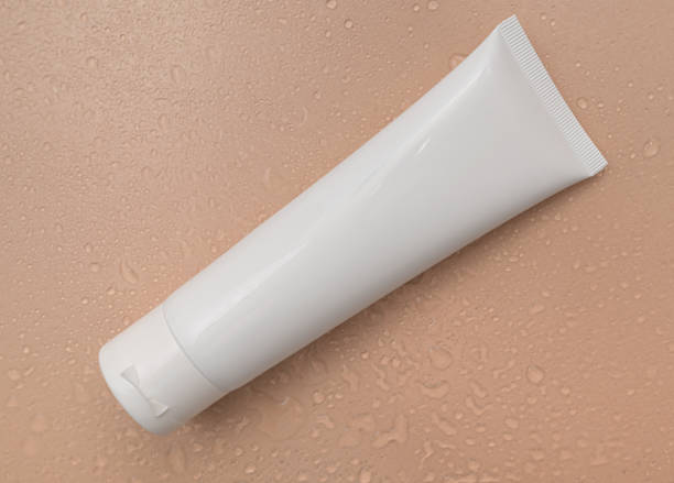 istock White container of cosmetic cream on a beige background. 1356397198