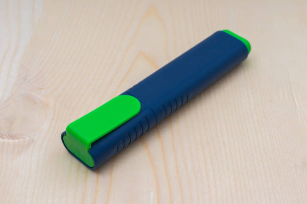 istock a new green marker is on a wooden table 1356397573