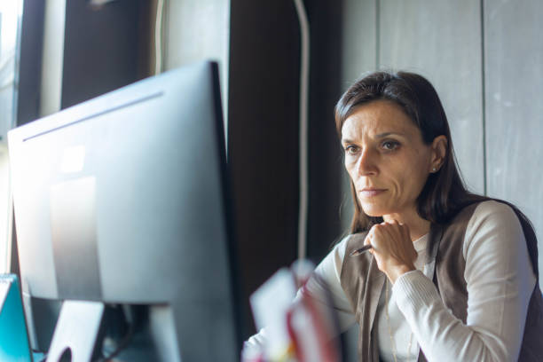 istock businesswoman typing an e-mail on laptop at home office 1356402465