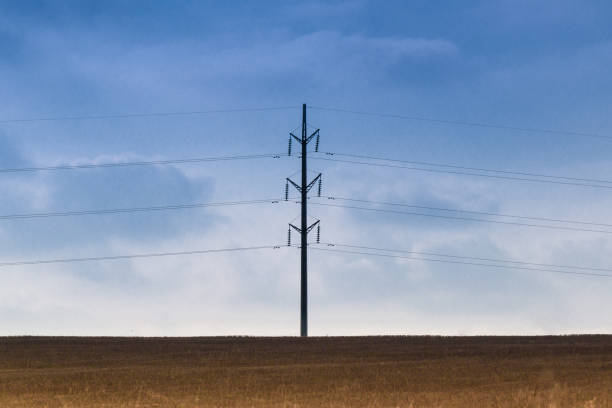 istock power line in the field against the blue sky 1356403995