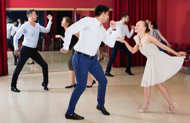 istock Positive people dancing twist in pairs 1356404039