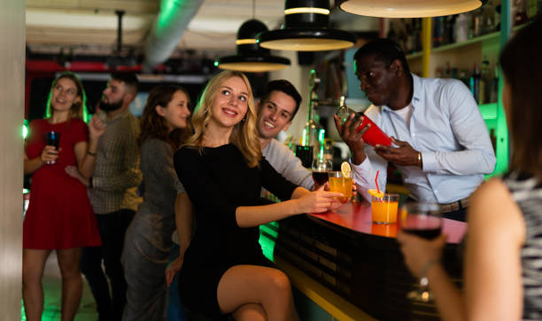 istock African american man bartender making cocktail for couple 1356404268