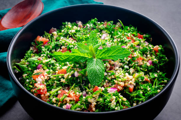 istock Authentic Lebanese Tabbouleh Garnished with Mint Leaves 1356404343