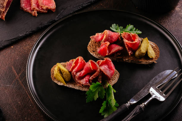 istock homemade dried meat on a background with vegetables 1356405347