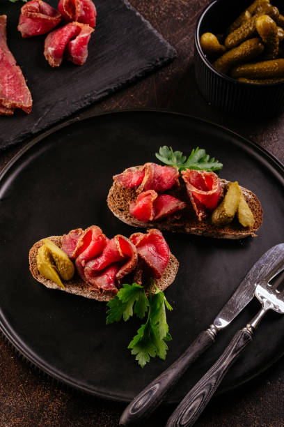 istock homemade dried meat on a background with vegetables 1356405349