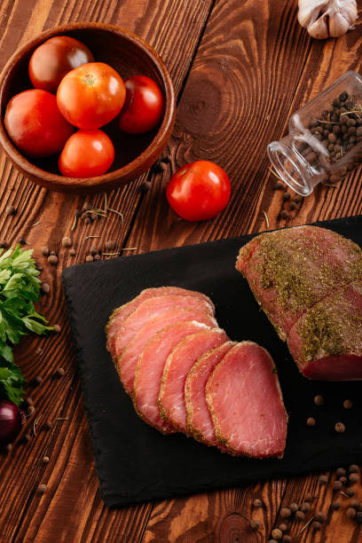 istock homemade dried meat on a background with vegetables 1356405366