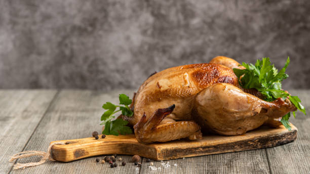 istock Whole roasted chicken with vegetables. Close up 1356405564