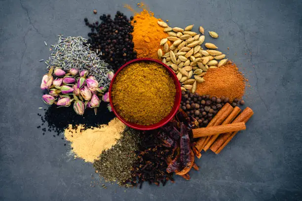 A dish of Moroccan spice blend made of dried herbs, spices, and flowers