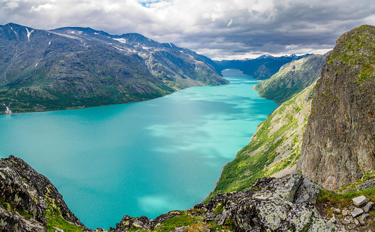 View of turquoise lake gjende from the famous Besseggen hiking trail in jotunheimen national park, Norway