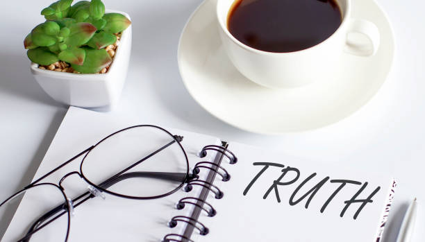 istock TRUTH text on notepad with glasses and cup of coffee 1356408772
